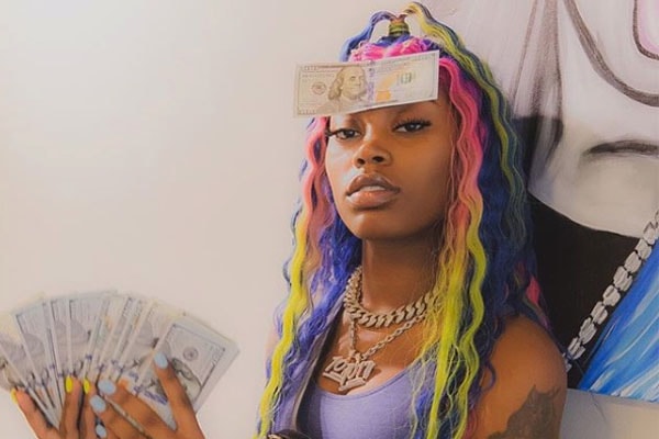 Asian Doll net worth and posing with money