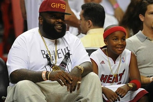 Rick Ross and his son William Roberts III enjoying a basketball match